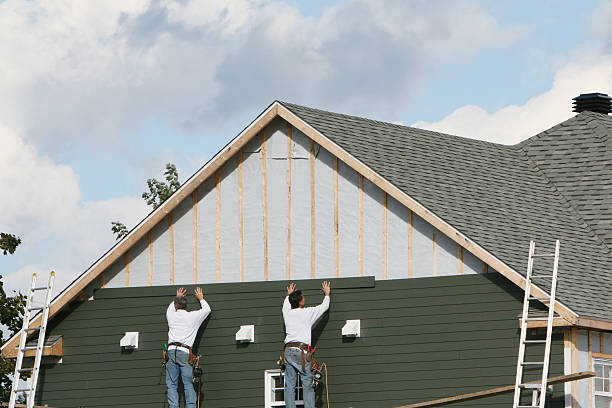 Professional Siding Replacement technician working in Smithville, OH